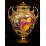 A Royal Worcester twin-handled vase and cover painted fruit and foliage and with gilt cover,