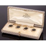 A set of four onyx and diamond dress buttons, set in 18ct gold, 13mm diameter,