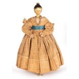 A Grodnertal 18th Century painted wooden doll with moulded hair piece, wooden arms and legs,