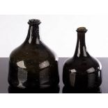 Two green glass onion wine bottles,