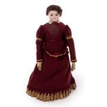 A French bisque head fashionable doll with chamois body and original clothes,