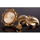 An 18ct gold ring set with a small Mexican token, gross weight approximately 4.