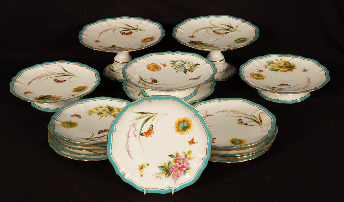 An English part dessert service decorated butterflies and flowers, comprising four small comports,