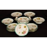 An English part dessert service decorated butterflies and flowers, comprising four small comports,