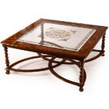 A large glass top coffee table by Jonathan Charles, the bevelled glass with eglomise decoration,
