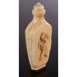 A Chinese ivory snuff bottle, Qing Dynasty, of flattened baluster shape,