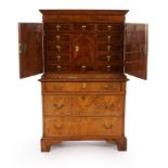 An 18th Century walnut and featherbanded cabinet on chest, (alterations),