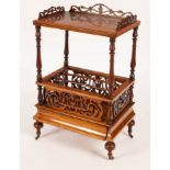 A Victorian walnut three-division Canterbury with galleried top and fret carved panels to the sides,
