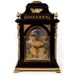 A George III ebony veneered, eight-day, quarter chime table clock by Gravell, London,