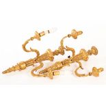 A pair of 18th Century carved gilt wood two-branch wall lights,