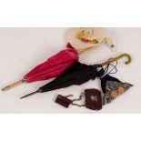 A lizard skin dolls bag and wallet, two parasols etc.