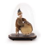 A mid 19th Century French walking Polichinelle clown automaton, beating a drum and symbol,