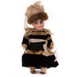 A German Gebruder Heubach googly eyed character doll, in later clothes, 21.