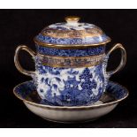 A late 18th Century blue and white willow pattern cup, cover and stand,