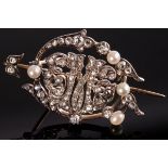 A diamond and pearl brooch of openwork form,