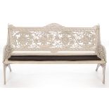 A Coalbrookdale horse chestnut pattern garden bench, painted white and with slatted seat,