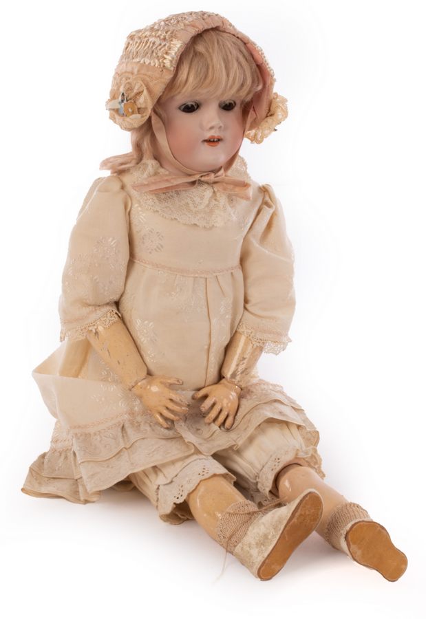 A German bisque head doll by Handwerg with composition body,
