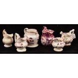 Six pink lustre jugs with various decoration, 19th Century,