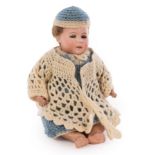 A German DEP character doll, with sleepy eyes and jointed limbs, in a later knitted dress,