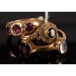 An amethyst three-stone ring set in 18ct gold, size L, approximately 8.