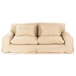 A large four-seater sofa, fitted loose seat and back cushions, 230cm wide,