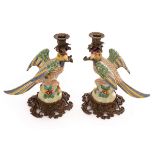 A pair of candle holders modelled as parrots, with gilt metal mounts,