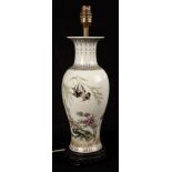 A white glazed table lamp decorated swallows in flowering branches, with shade,