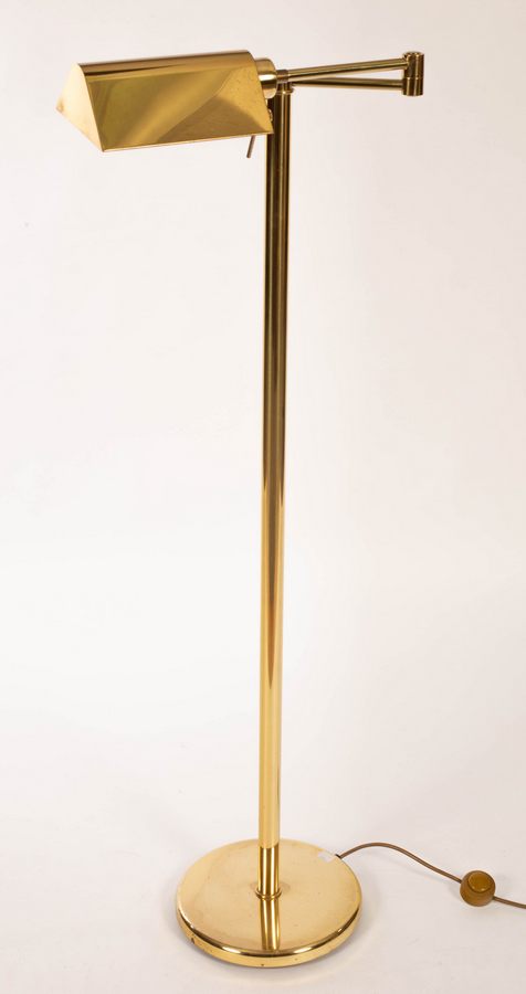 An adjustable brass reading lamp,