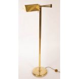 An adjustable brass reading lamp,