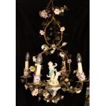 An early 20th Century gilt metal and Meissen porcelain mounted four-light chandelier with a