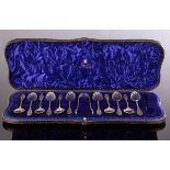 A set of eleven Victorian silver teaspoons and the matching sugar tongs, Wakely & Wheeler,