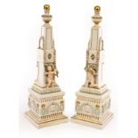 A pair of Royal Copenhagen obelisks, each of tapering form with urn finials,