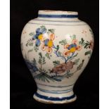 A Dutch delft polychrome baluster vase, late 18th Century, painted with Oriental style flowers,