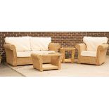 A wicker two-seater sofa,