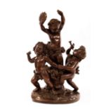 A large French bronze Bacchus group of three putti, the central raised figure with tambourine,