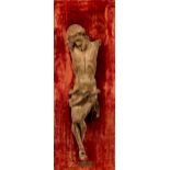 An early 18th Century carved wood figure of Christ crucified, with faded polychrome decoration,