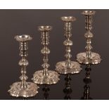 A matched set of four George II cast silver candlesticks, two by Gabriel Sleath, London 1753,