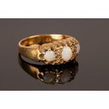 An opal and diamond ring, set in 18ct yellow gold,