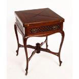 An Edwardian envelope card table on cabriole legs, united by an X shaped stretcher,