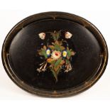 A Victorian oval papier-mâché tray painted a bouquet of flowers,