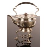 A circular silver tea kettle and stand, London 1915,