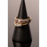 A diamond three-stone ring, set in 18ct gold and platinum,