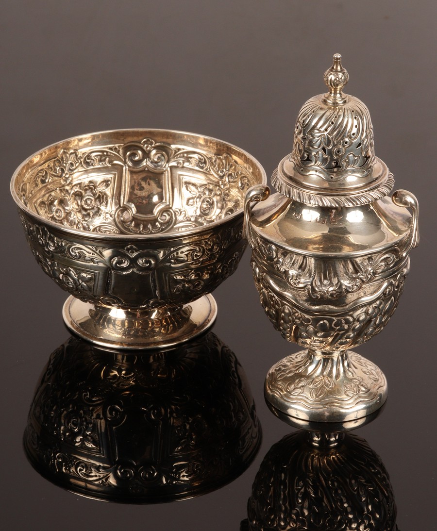 An Edwardian silver bowl, GW, Sheffield 1902, 12cm diameter and a silver caster, Birmingham 1902,