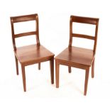A pair of mahogany chairs with solid seats,