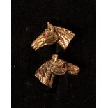 A pair of 9ct gold horse head cufflinks, Cropp & Farr, 1971, each with a ruby set eye,