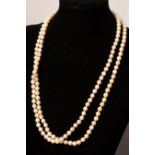 A two-row cultured pearl necklace with gold clasp,