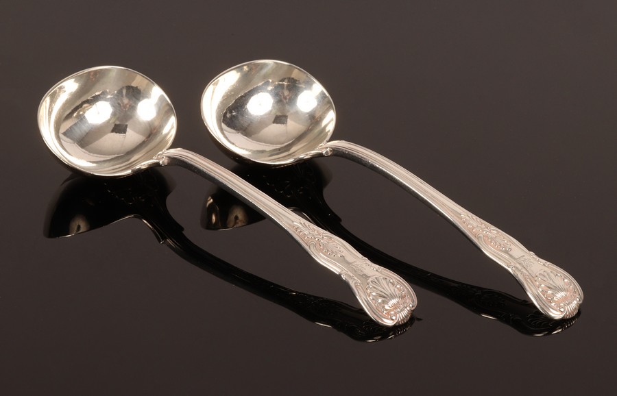 A pair of Kings pattern silver sauce ladles, WE, London 1830, crested,