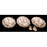 Three plated shaped oval entrée dishes and covers with decorative shell,