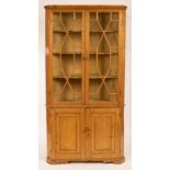A pine corner cupboard with twin glazed doors and cupboard beneath CONDITION REPORT: