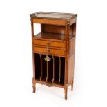 An Edwardian satinwood cabinet with gilded brass gallery to the marble top,